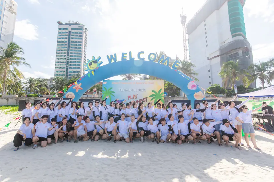The whole company gathered on the beach for teambuilding